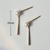 Stud Earrings with 6mm Cultured Akoya pearls in 14Kt Gold Diamonds